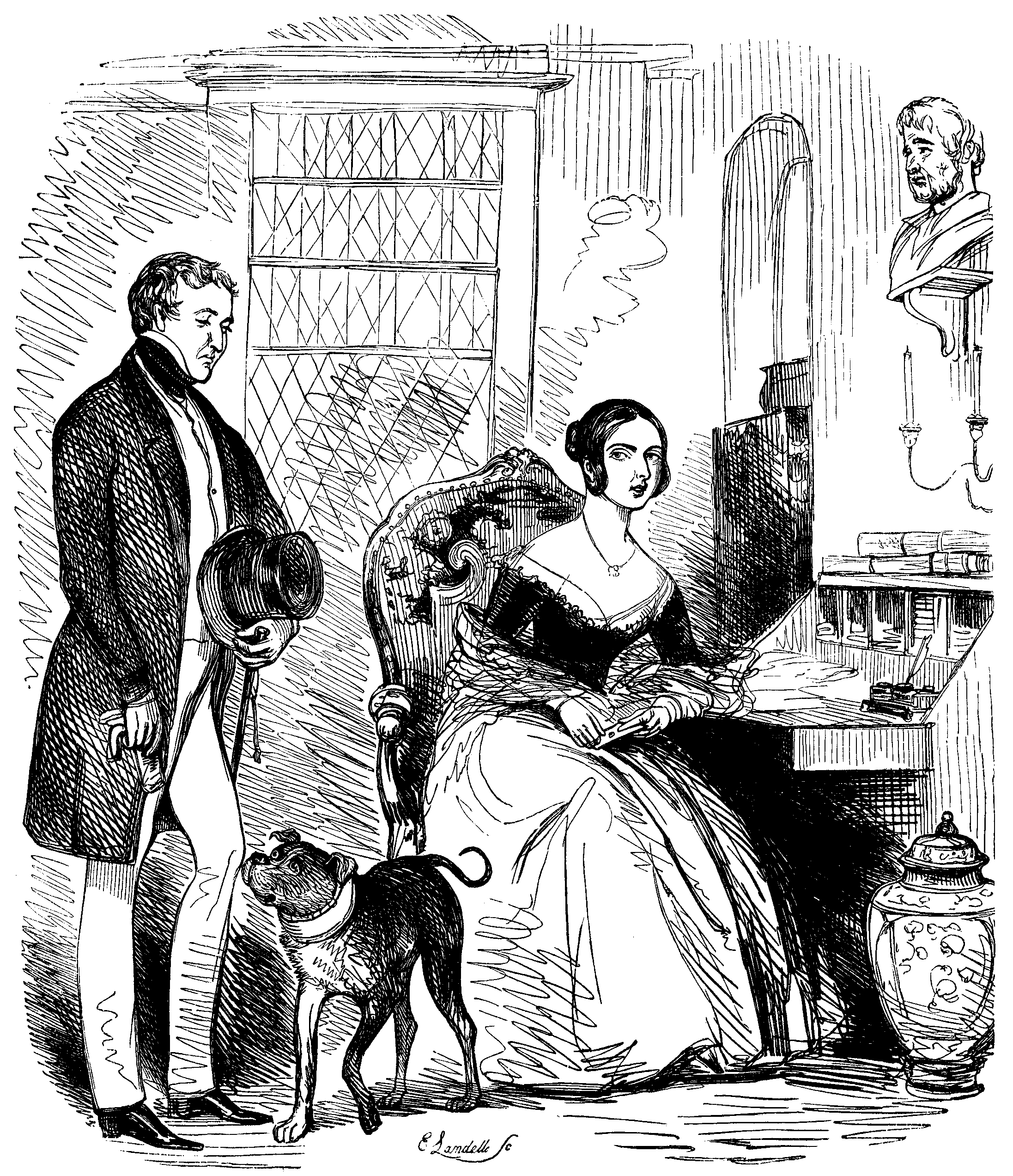 A woman sits at a desk while a gentleman looks on.