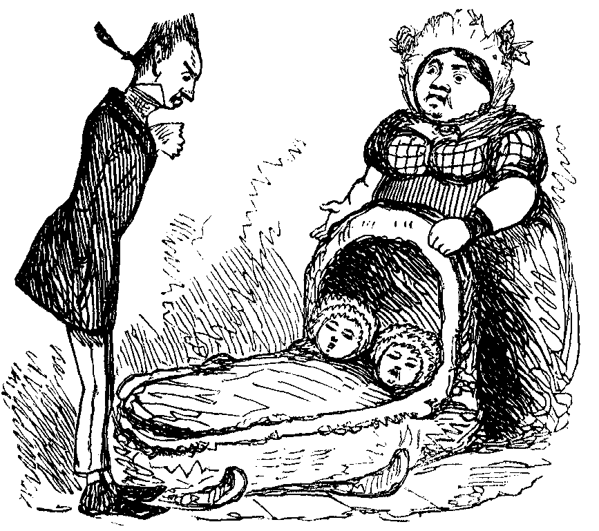 A man looks down on a cradle with twin babies in it.