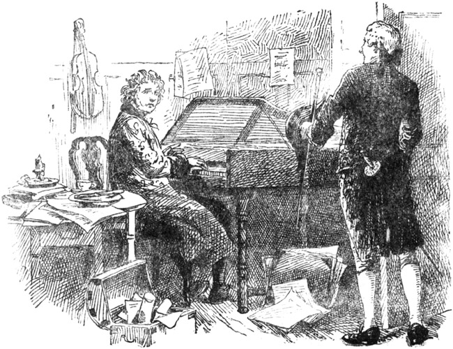 Seated before an old, worn-out piano.
